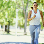 portrait of a mid adult woman jogging in a park